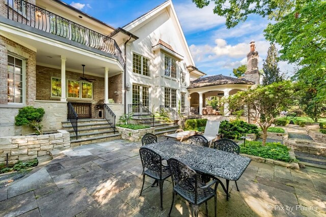 view of patio featuring a balcony