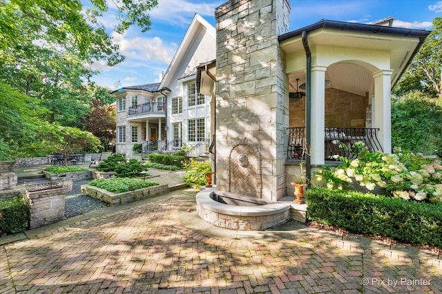 back of property with a patio