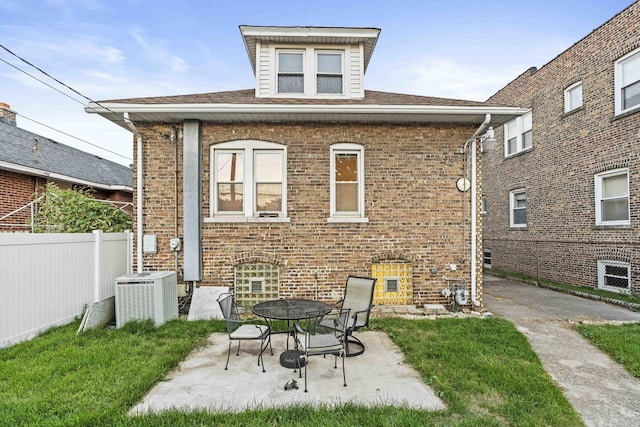 1632 Stanton Ave, Whiting, IN 46394 - rear view of property with fence, central AC, a patio area, and brick siding