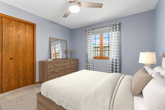 carpeted bedroom with ceiling fan