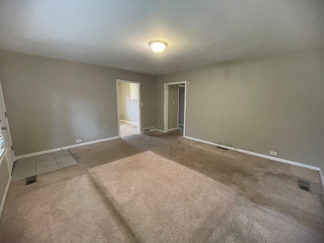 unfurnished bedroom with a spacious closet, carpet flooring, and a closet