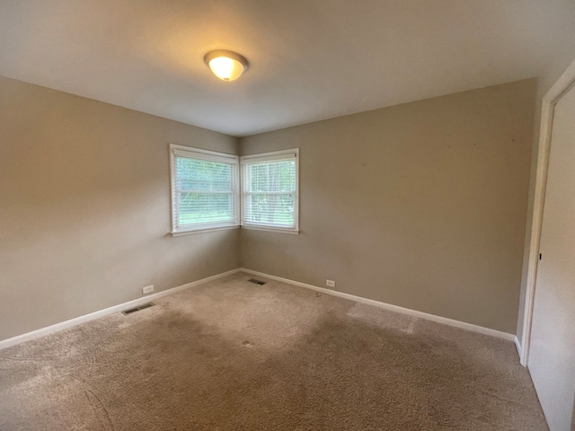 unfurnished room featuring carpet floors