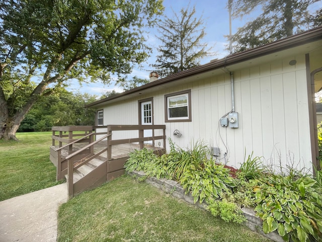 view of property exterior featuring a lawn