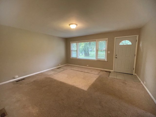 view of carpeted entrance foyer