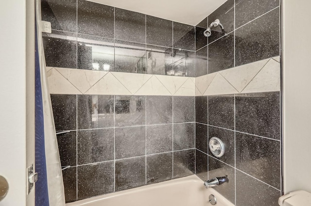 bathroom with washtub / shower combination