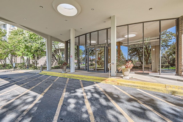 property entrance with uncovered parking