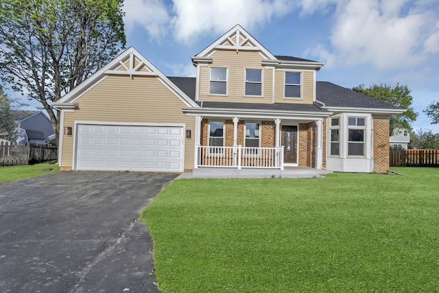 view of front of property with fence, a front lawn, aphalt driveway, a garage, and a porch