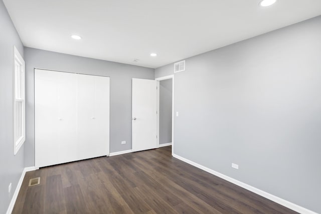 unfurnished bedroom with recessed lighting, baseboards, and visible vents