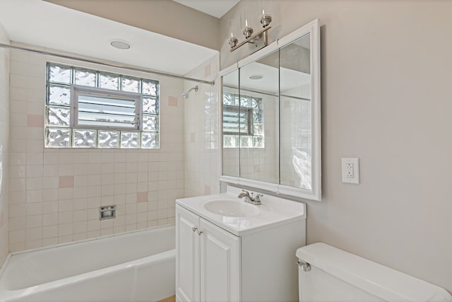 full bathroom with vanity, toilet, and tiled shower / bath