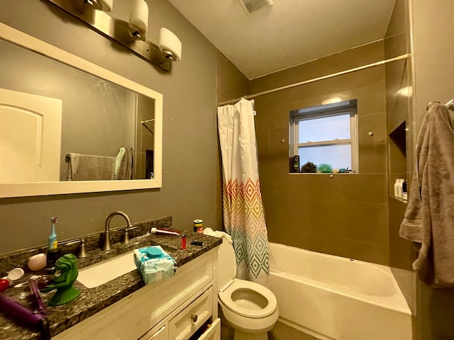 full bathroom featuring toilet, shower / tub combo with curtain, and vanity