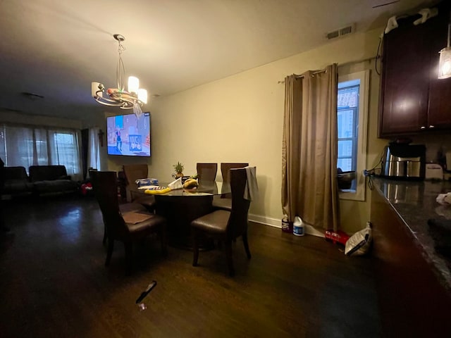 dining room featuring a wealth of natural light, a chandelier, and hardwood / wood-style flooring