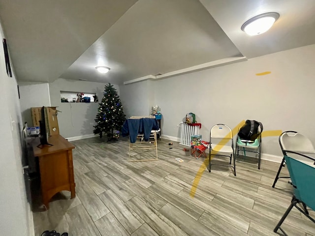 sitting room with wood-type flooring