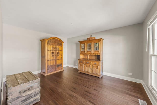 unfurnished room featuring dark hardwood / wood-style flooring