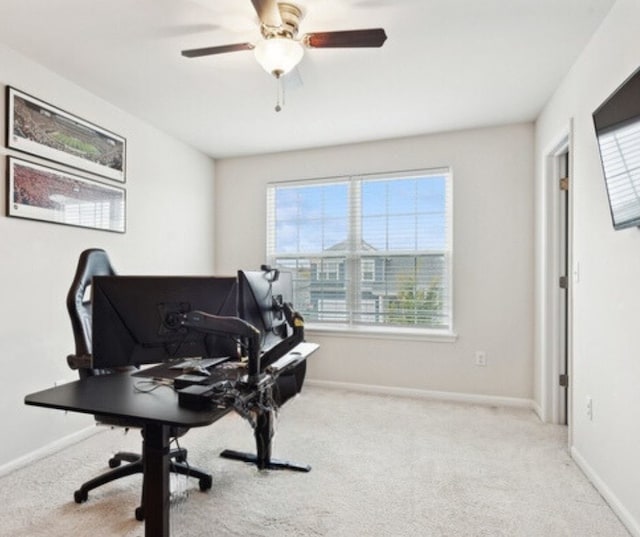 interior space with light colored carpet and ceiling fan