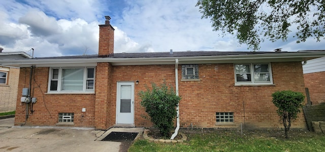 back of property with a patio