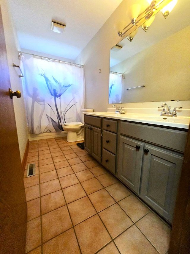 full bathroom with toilet, shower / bath combination with curtain, vanity, and tile patterned floors