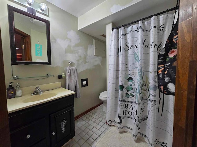 bathroom featuring vanity, toilet, tile patterned floors, and a shower with shower curtain