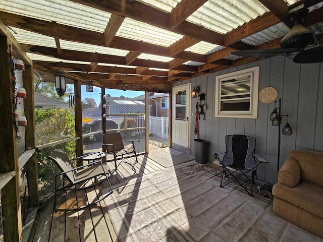 sunroom featuring beamed ceiling