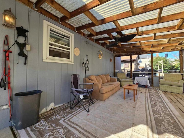 sunroom / solarium featuring ceiling fan