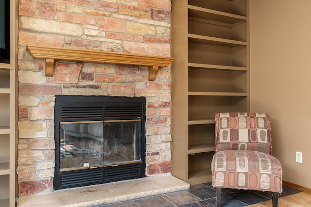 details featuring hardwood / wood-style flooring and a fireplace