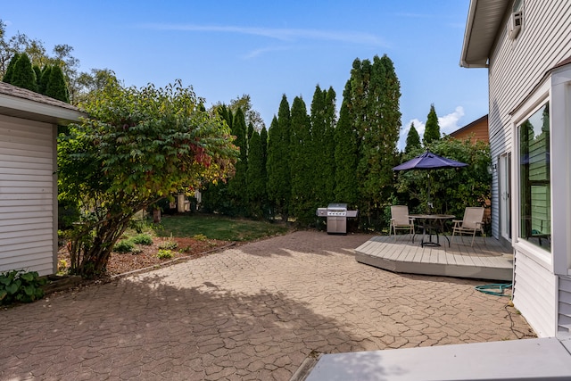 view of patio / terrace featuring grilling area and a deck