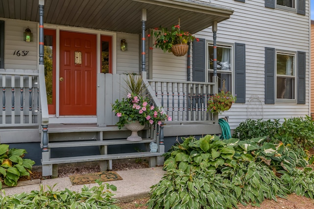 property entrance with covered porch