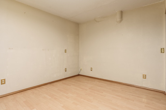 unfurnished room with light hardwood / wood-style flooring