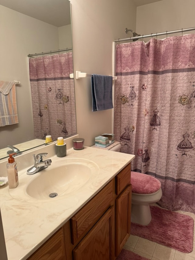 bathroom featuring vanity, tile patterned floors, toilet, and a shower with curtain