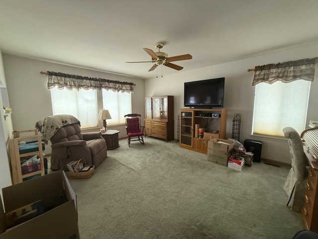 living room featuring ceiling fan and carpet floors