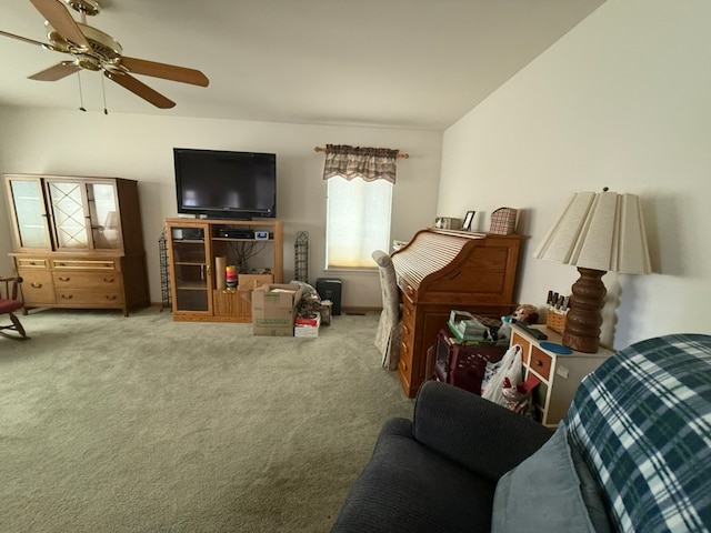 carpeted living room with ceiling fan