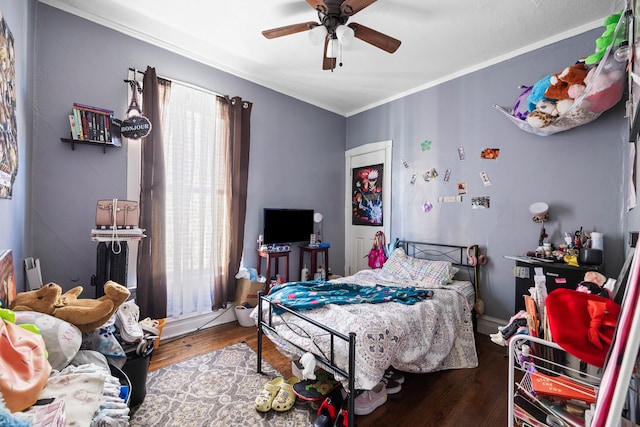 bedroom with ceiling fan, hardwood / wood-style flooring, and ornamental molding