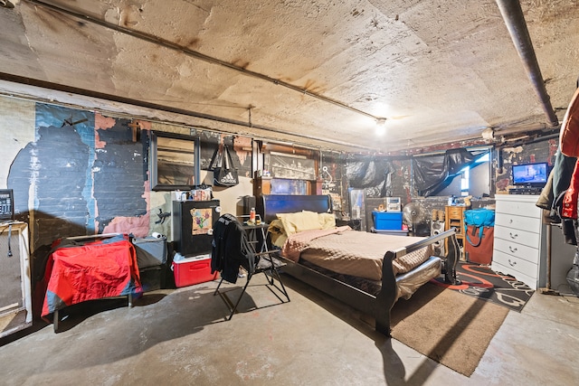 bedroom featuring concrete floors