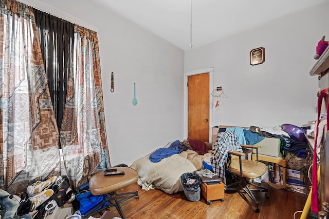 bedroom with wood-type flooring