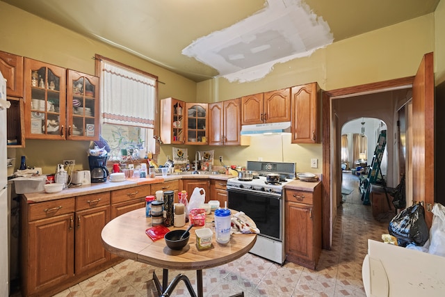 kitchen with white gas range oven