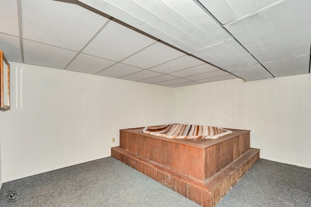 bar with a drop ceiling and carpet