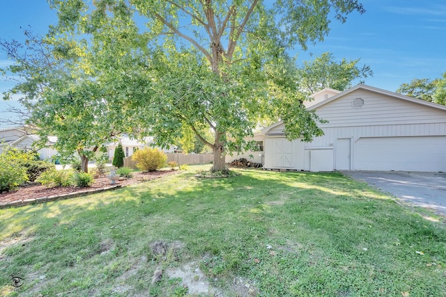 view of yard featuring a garage