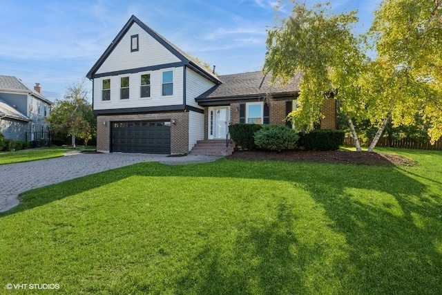 view of front of house featuring a garage and a front yard