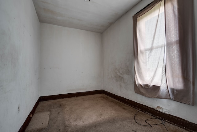 spare room featuring vaulted ceiling