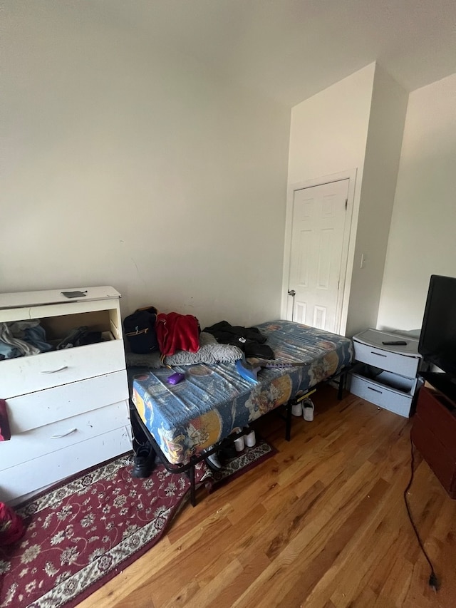 bedroom with hardwood / wood-style floors