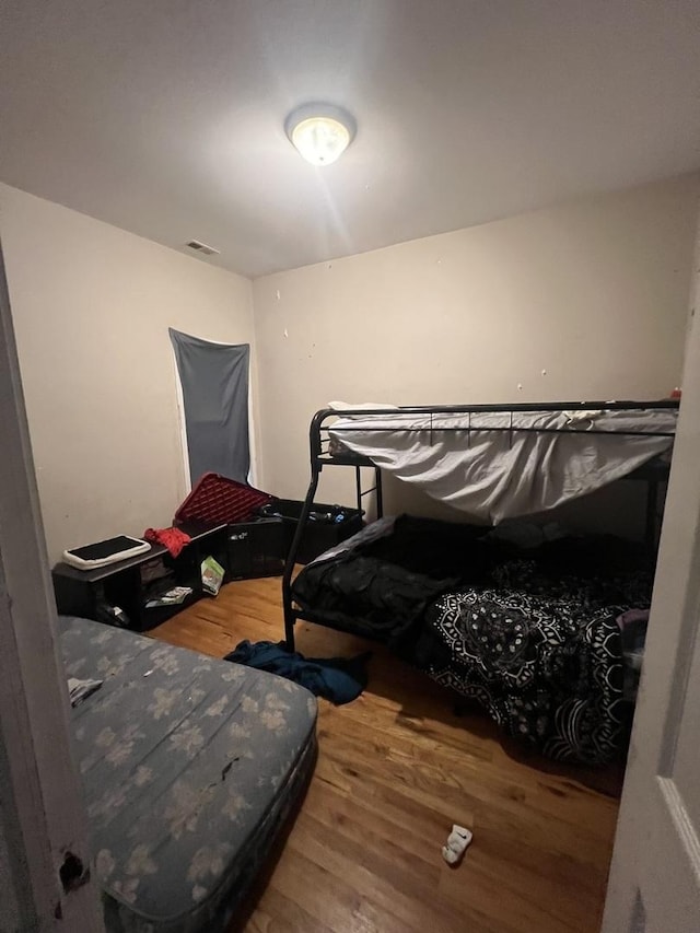 bedroom featuring wood finished floors