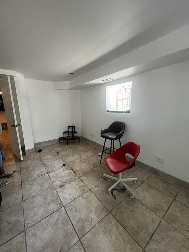 below grade area with tile patterned flooring