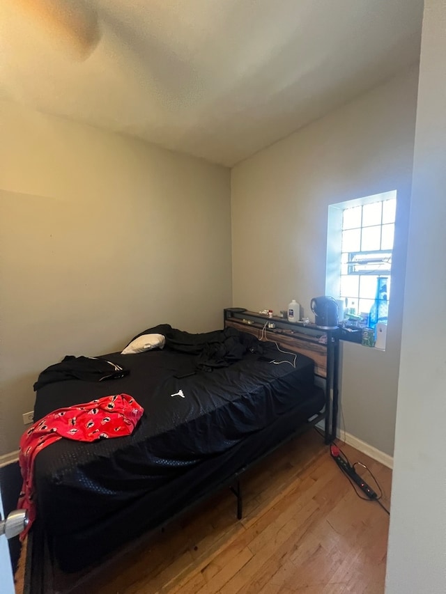 bedroom with light wood-type flooring