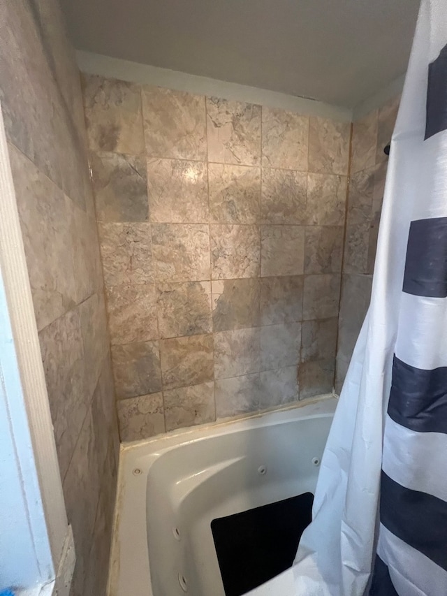 bathroom with shower / bathtub combination with curtain