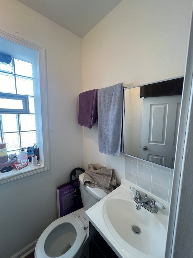 bathroom featuring vanity and toilet