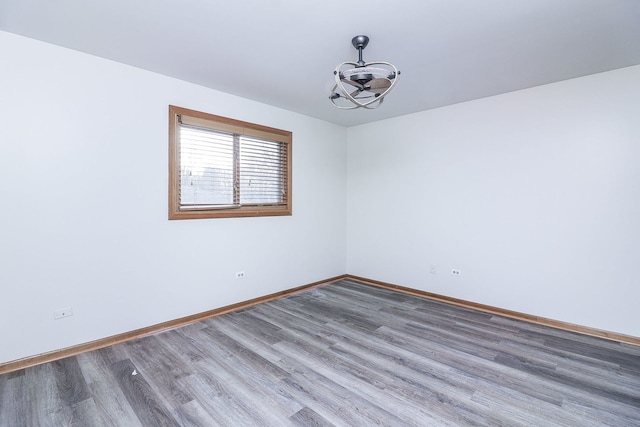 empty room featuring wood-type flooring