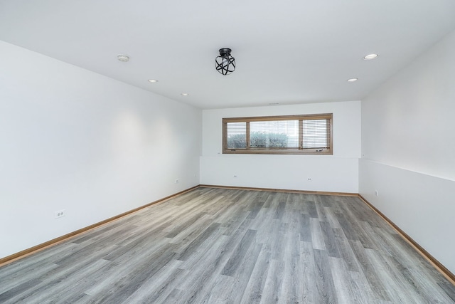 unfurnished room featuring light hardwood / wood-style flooring