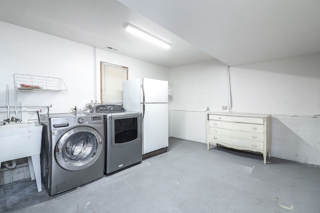 laundry room with washer and clothes dryer