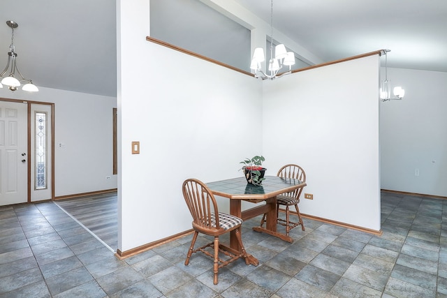 dining area with vaulted ceiling and an inviting chandelier