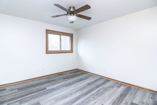 unfurnished room with wood-type flooring and ceiling fan