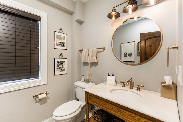 bathroom featuring toilet and vanity